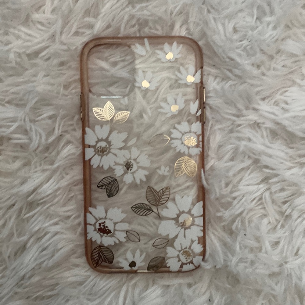 Clear phone case with white and gold flowers.